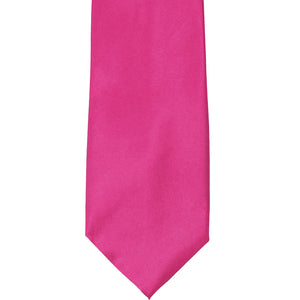 The front of a bright fuchsia solid tie, laid out flat
