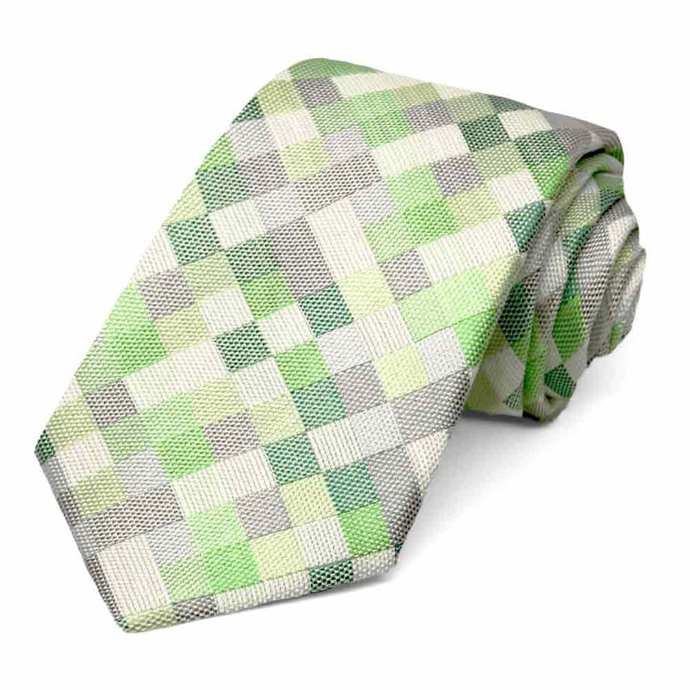 Green and gray checkered tie, rolled to show the woven texture