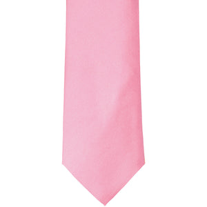 The front of a bright pink solid tie, laid out flat