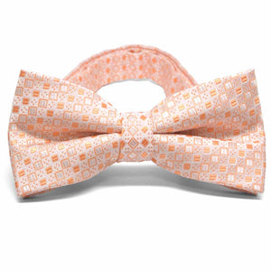 Light orange square pattern bow tie, close up front view