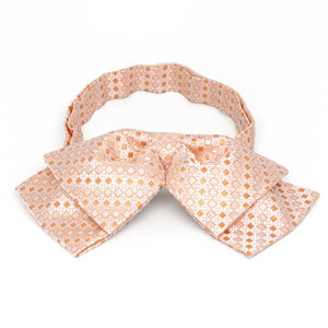 Light orange square pattern floppy bow tie, front view
