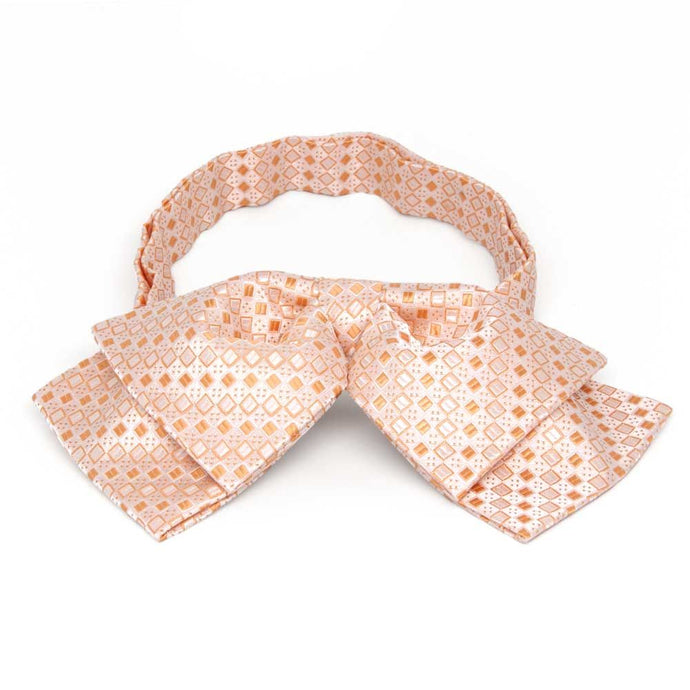 Light orange square pattern floppy bow tie, front view