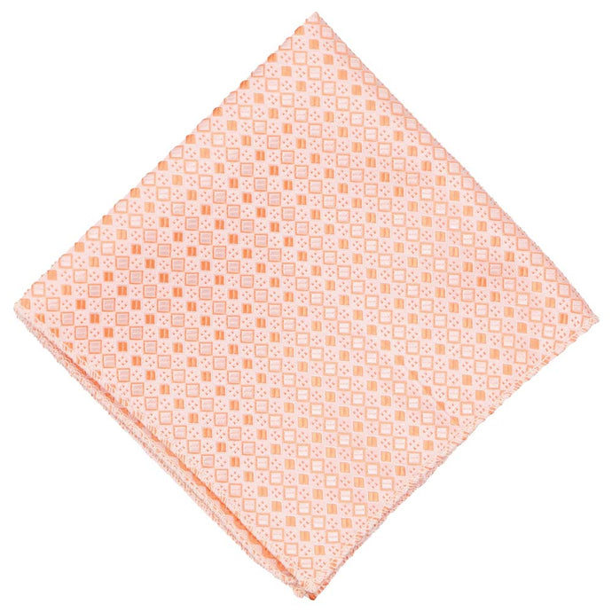 A light orange pocket square with a square pattern, folded to a diamond