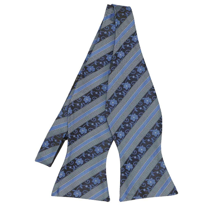 Flat front view of an untied blue floral stripe self-tie bow tie