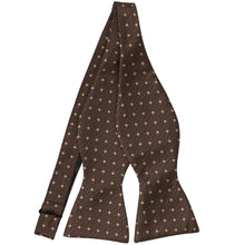Load image into Gallery viewer, A brown textured self tie bow tie (untied) with lighter brown polka dots