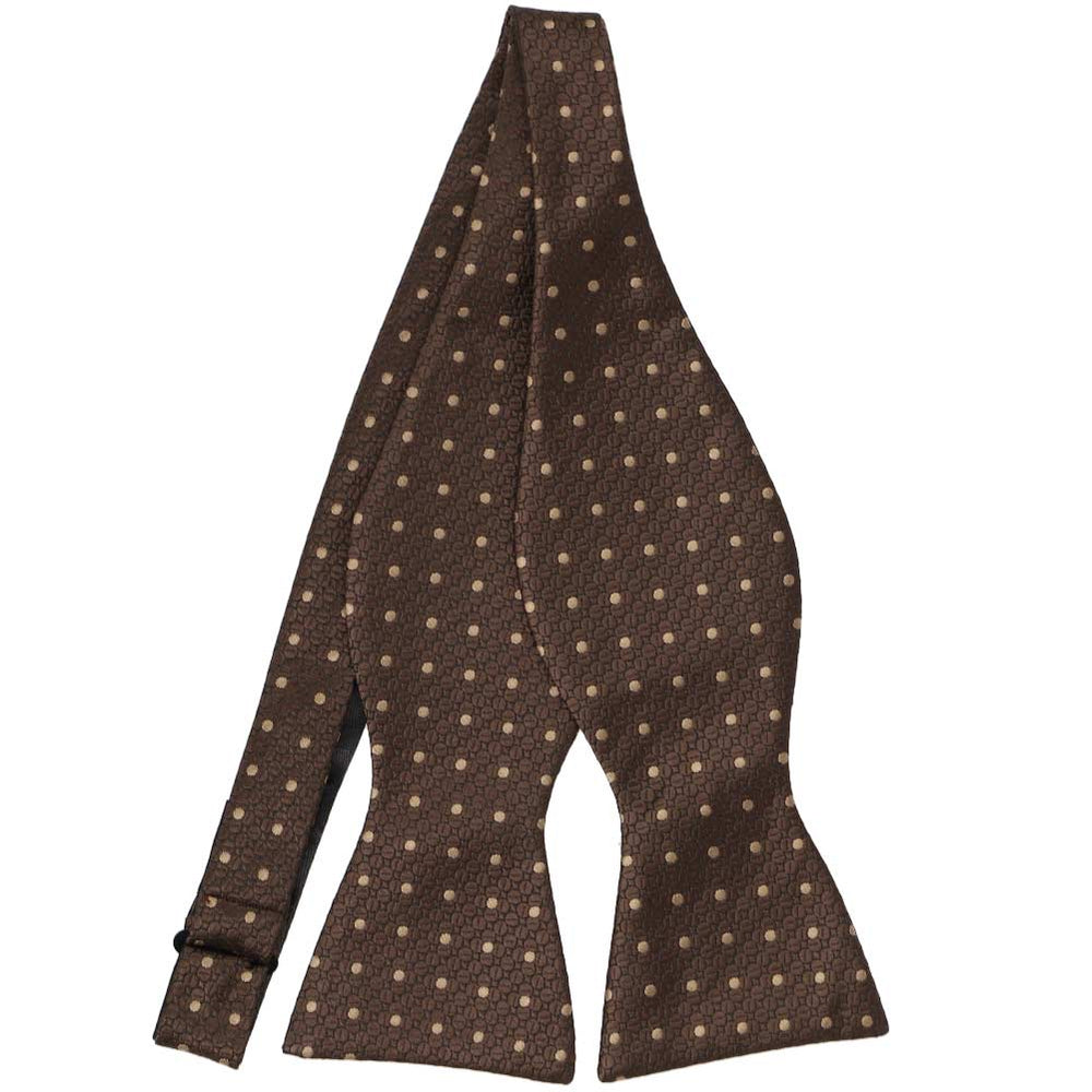 A brown textured self tie bow tie (untied) with lighter brown polka dots