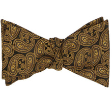 Load image into Gallery viewer, A tied self-tie bow tie in a brown paisley pattern