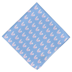 A light blue pocket square folded into a diamond with an all over bunny ears pattern