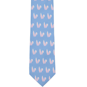 The front of a bunny ears pattern tie, laid out flat, in blue, white and pink