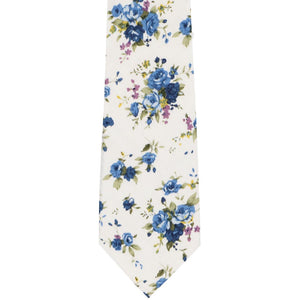 A dusty blue and white floral tie, laid out flat