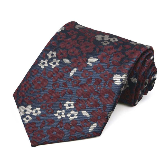 Burgundy and navy blue floral silk tie rolled to show texture