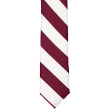 Load image into Gallery viewer, The front of a burgundy and white striped skinny tie, laid out flat