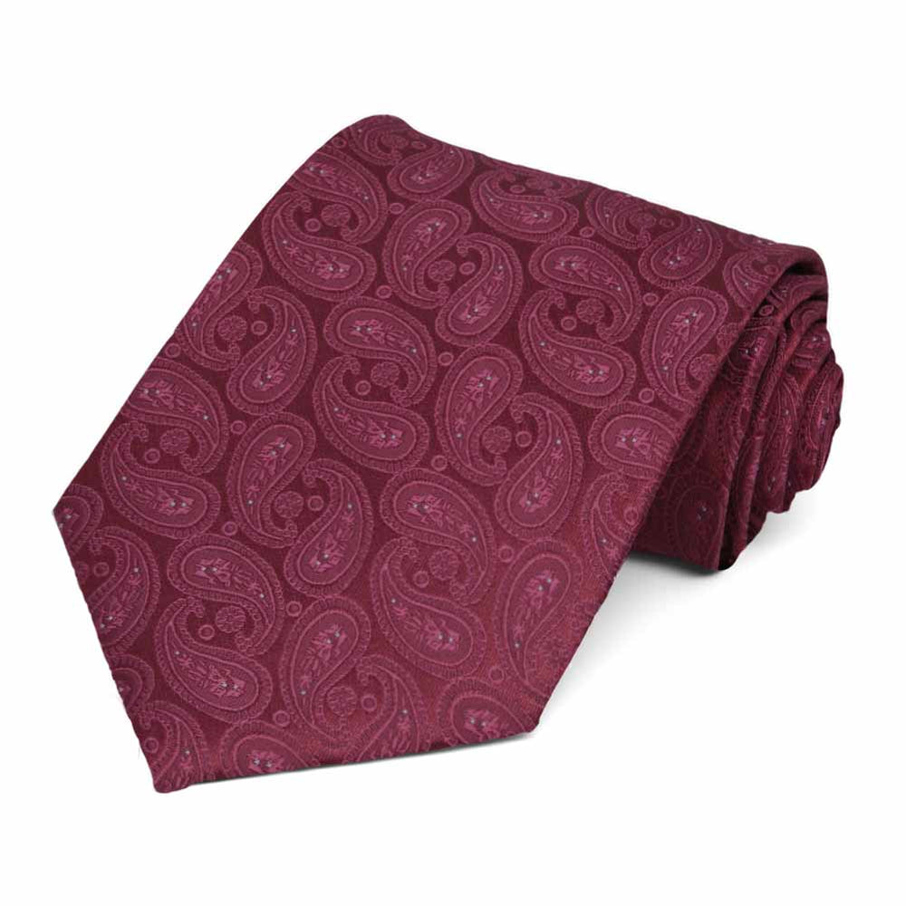 Rolled view of a burgundy paisley necktie