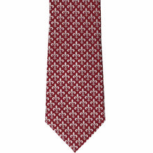 Load image into Gallery viewer, The front of a burgundy tie with a fleur de lis pattern