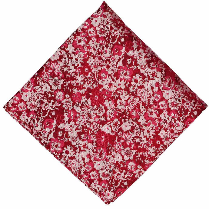 A folded light red dark red and white abstract floral pocket square
