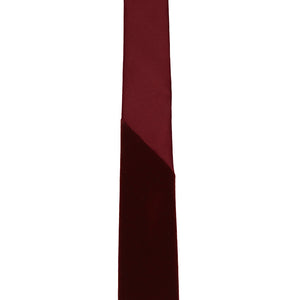 The point on the collar of a velvet tie that transitions to a satin material to allow for an easier to tie knot