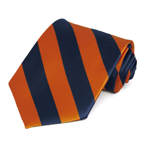 A burnt orange and navy blue striped tie, rolled to show off the stripes