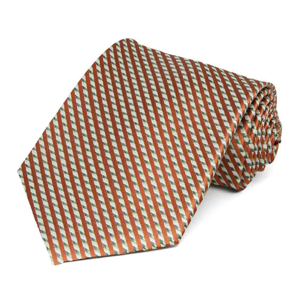 A burnt orange and tan striped necktie rolled to show off the pattern and texture