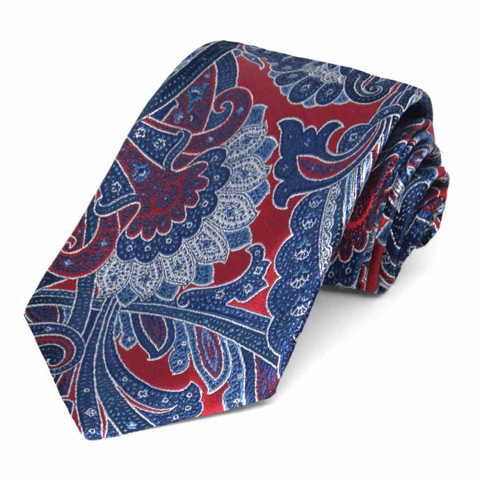Crimson red and blue paisley tie, rolled to show exquisite details