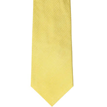Load image into Gallery viewer, The front of a butter yellow herringbone tie, laid out flat
