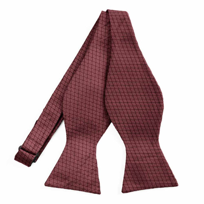 An untied dark red self-tie bow tie with a cross hatch pattern