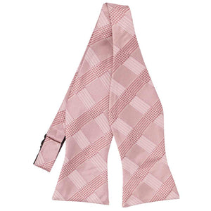 Pink plaid self- tie bow tie, untied flat front view