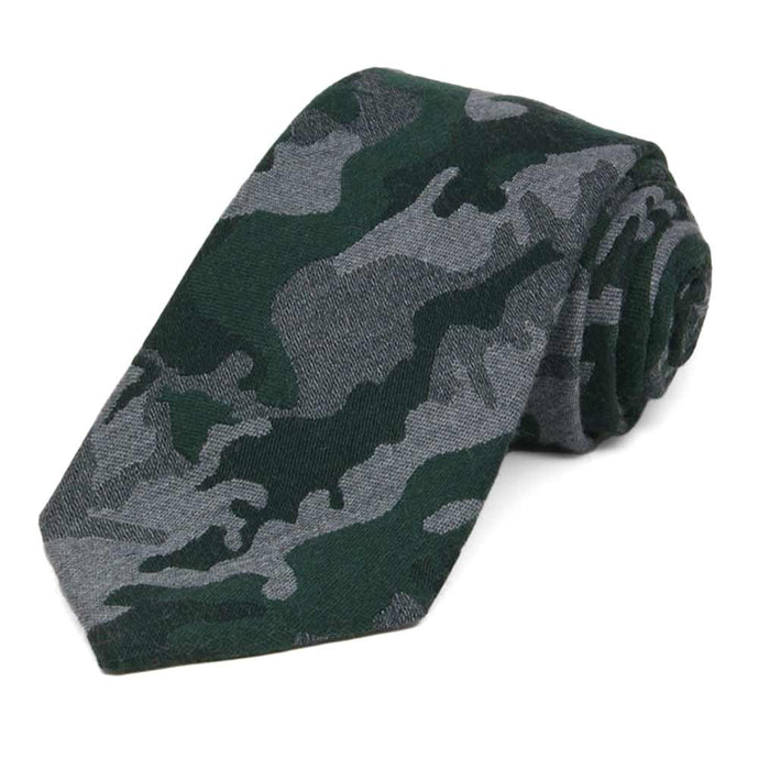 Green and gray camo tie, rolled to show woven texture