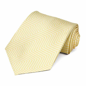 A light yellow chevron striped tie, rolled to show pattern and texture