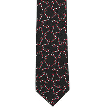 Load image into Gallery viewer, The front view of a black necktie with a candy cane pattern