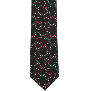 The front view of a black necktie with a candy cane pattern