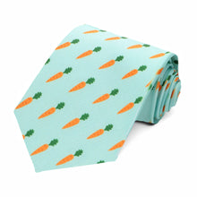 Load image into Gallery viewer, A rolled aqua colored necktie with an orange and green carrot pattern repeated across the tie.