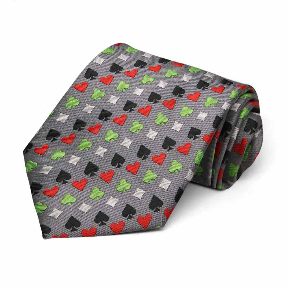 Green, white, black and red card suit casino pattern necktie on gray background