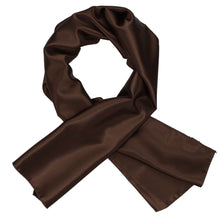 Load image into Gallery viewer, A women&#39;s chestnut brown solid scarf, crossed over itself