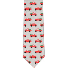Load image into Gallery viewer, The front of a gray slim tie with a red Christmas pickup truck and design