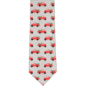 The front of a gray slim tie with a red Christmas pickup truck and design