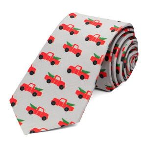 A slim gray tie with a Christmas pickup truck design