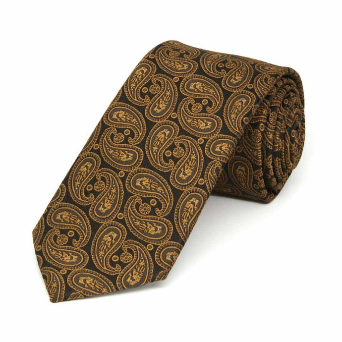 Dark brown and antique gold paisley slim necktie, rolled to show pattern