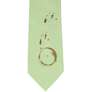 Flat front view of light green necktie with coffee ring