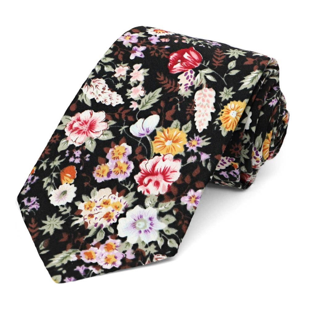 Rolled black, brown, and subdued wildflower floral pattern tie