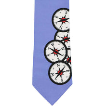 Load image into Gallery viewer, Cornflower blue necktie with compasses printed on it.