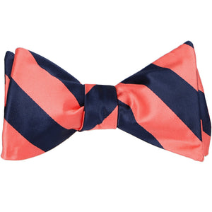A tied self-tie bow tie in coral and navy blue stripes