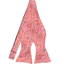 Load image into Gallery viewer, A detailed coral paisley self-tie bow tie, untied