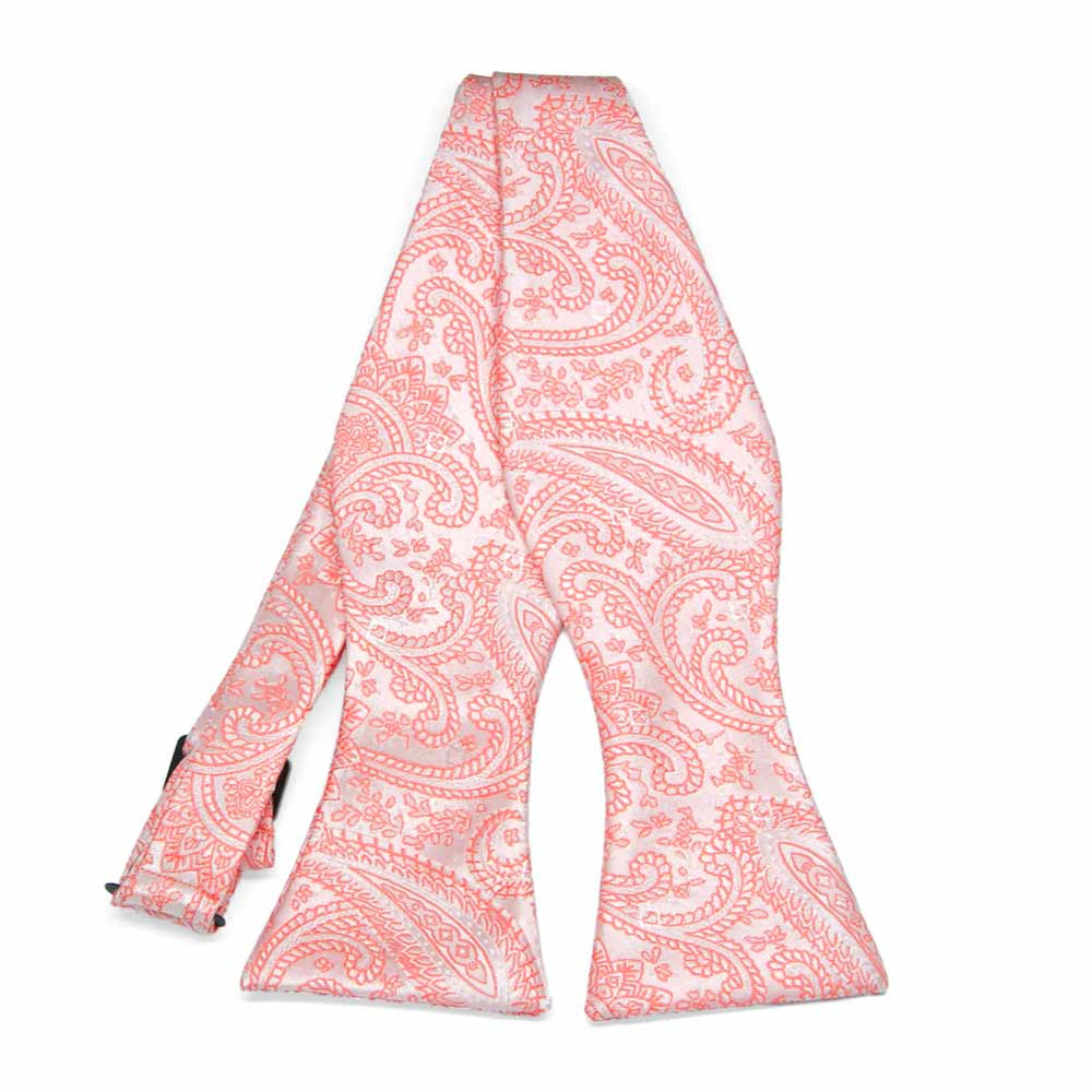 Coral paisley self-tie bow tie, untied flat front view