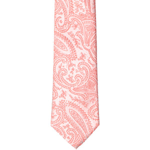 The front of a coral paisley slim tie
