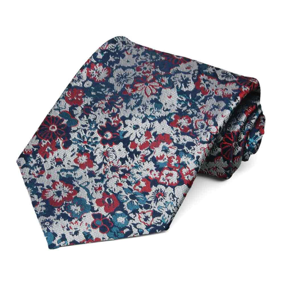 Detailed burgundy and loch blue floral tie, rolled to show woven texture