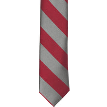 Load image into Gallery viewer, The front of a crimson red and gray striped skinny tie, laid out flat