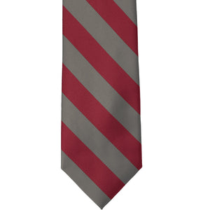 Front view of a crimson red and gray striped tie, laid out flat