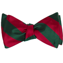 Load image into Gallery viewer, A hunter green and crimson red striped self-tie bow tie, tied