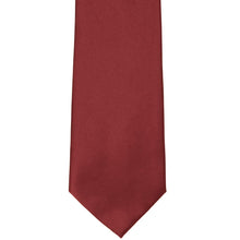 Load image into Gallery viewer, The front of a currant red solid tie, laid out flat
