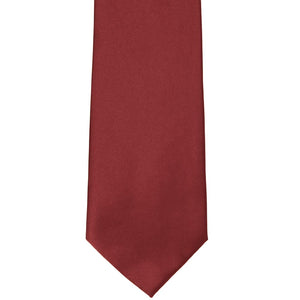 The front of a currant red solid tie, laid out flat
